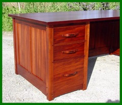 Close-up view of bank of drawers, "cloud-lift" designed stretchers and ebony detailing.